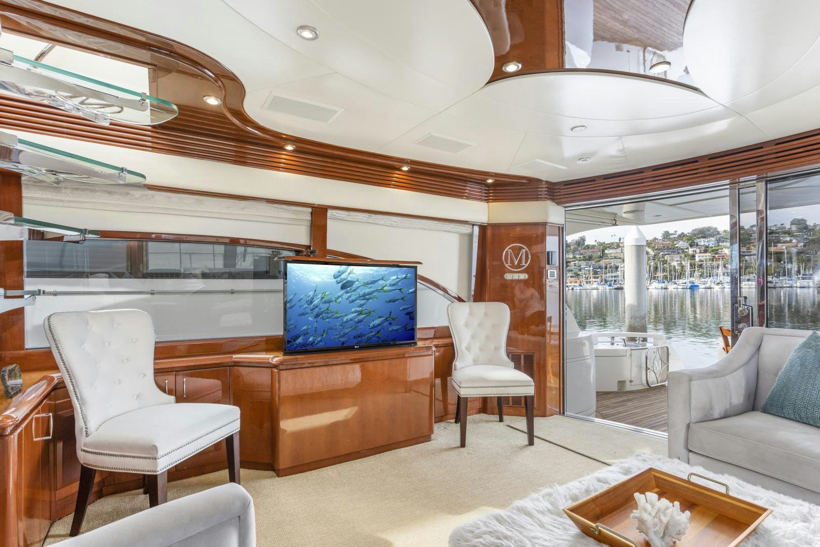 a room with a tv and chairs aboard MONDRIAN Yacht for Sale