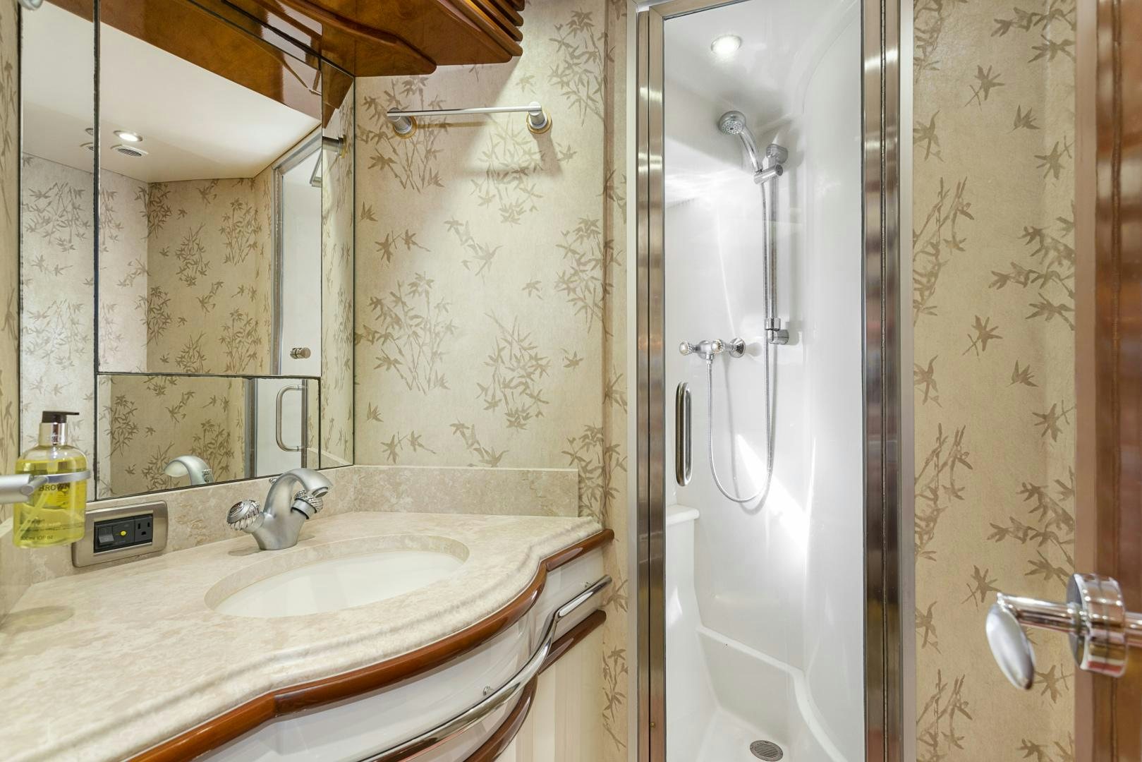 a bathroom with a shower and sink aboard MONDRIAN Yacht for Sale