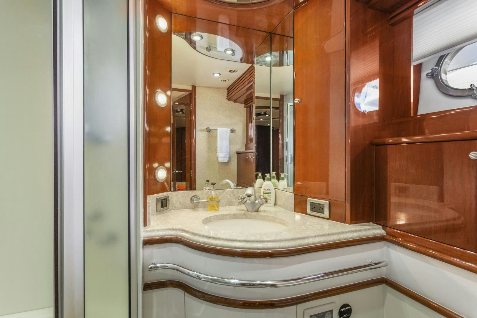 a bathroom with a large mirror aboard MONDRIAN Yacht for Sale