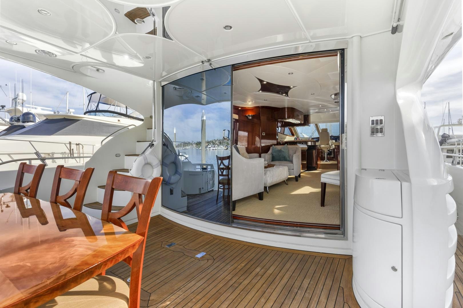 a room with tables and chairs aboard MONDRIAN Yacht for Sale
