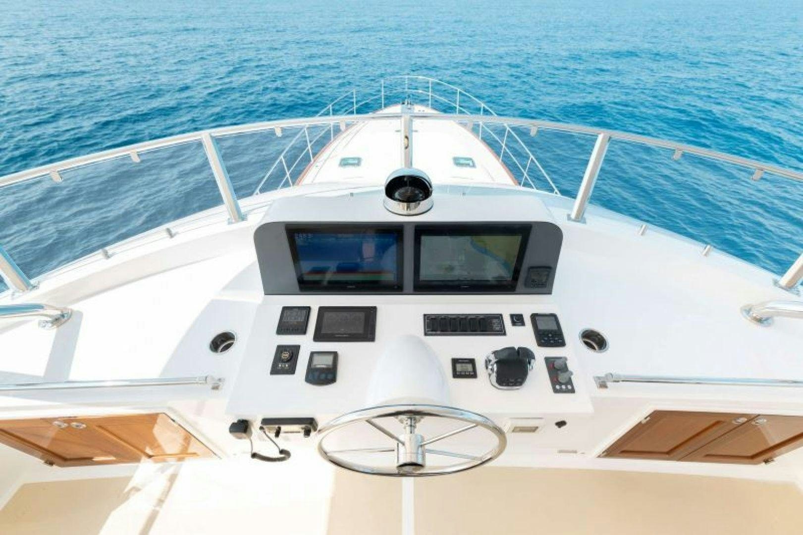a white boat with black windows aboard OCEAN 63 Yacht for Sale