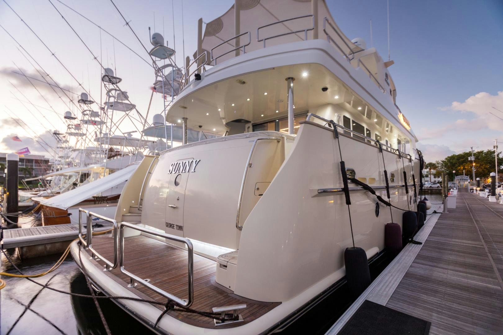 a large white ship docked aboard SUNNY Yacht for Sale