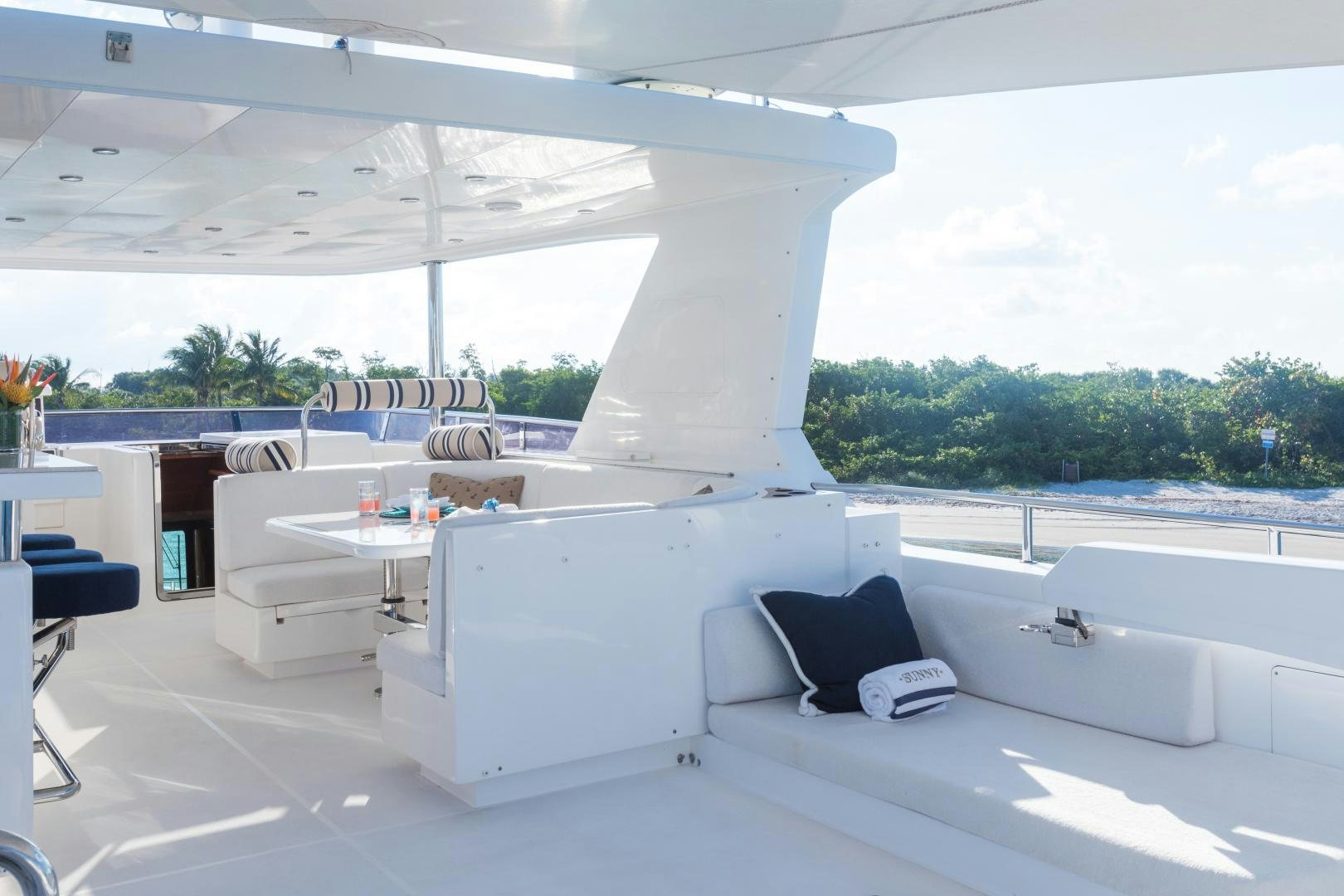 a large white room with a white bed and a black pillow aboard SUNNY Yacht for Sale