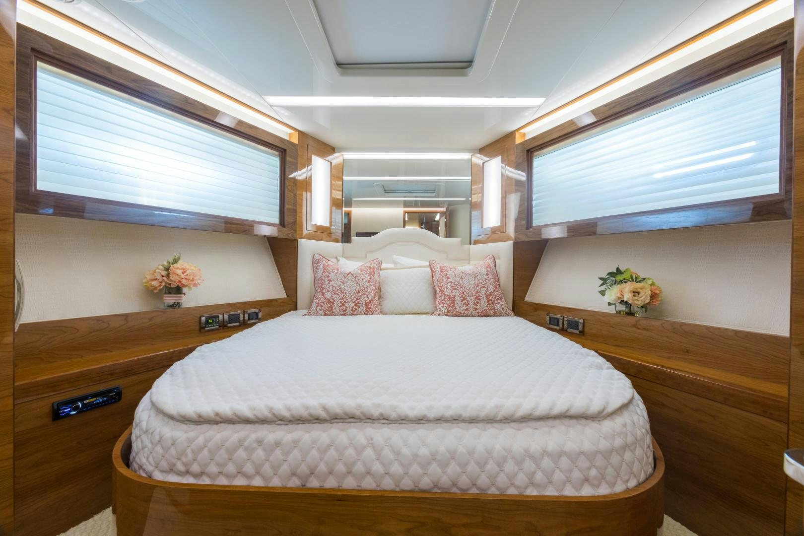 a bedroom with a bed and a desk aboard SUNNY Yacht for Sale