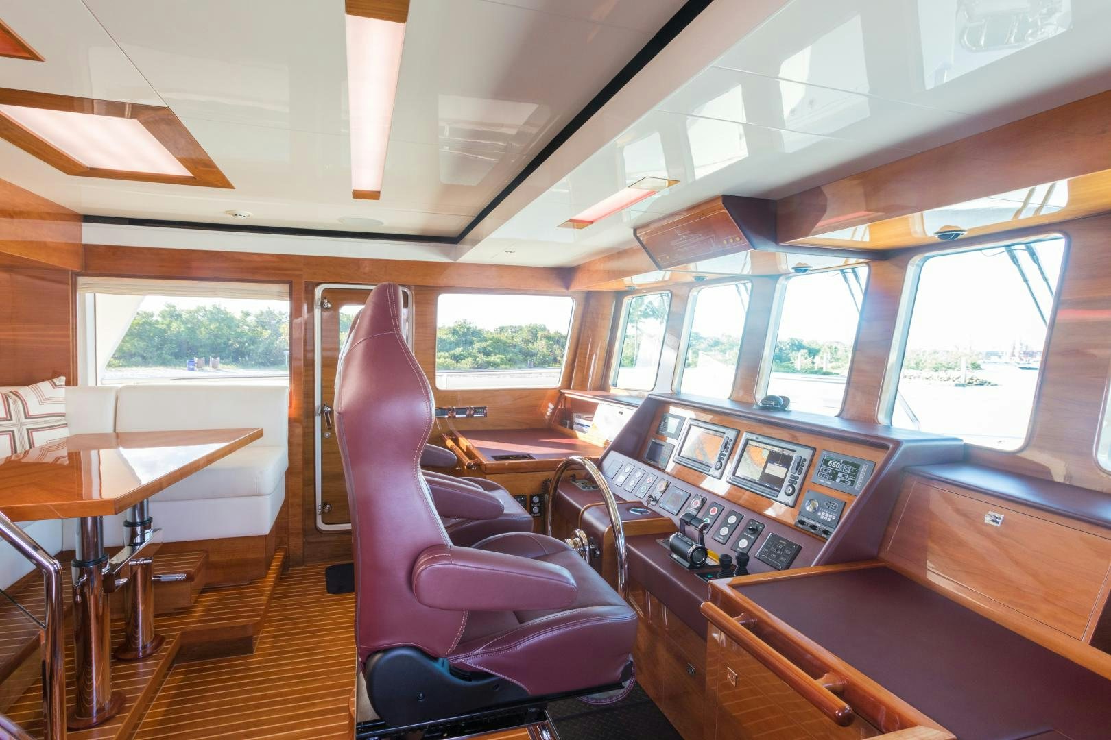 a room with a desk and chairs aboard SUNNY Yacht for Sale
