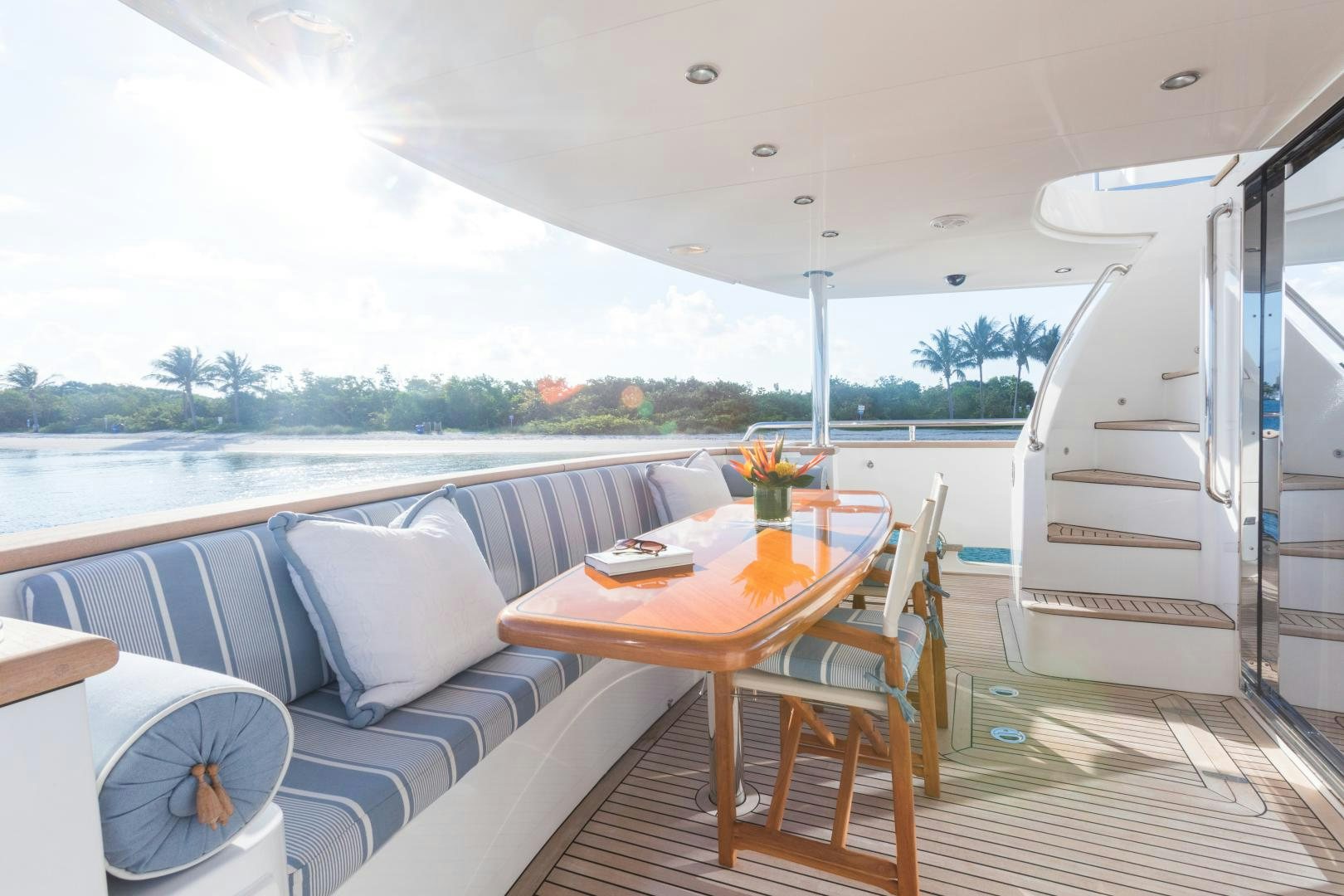 a boat with a table and chairs aboard SUNNY Yacht for Sale