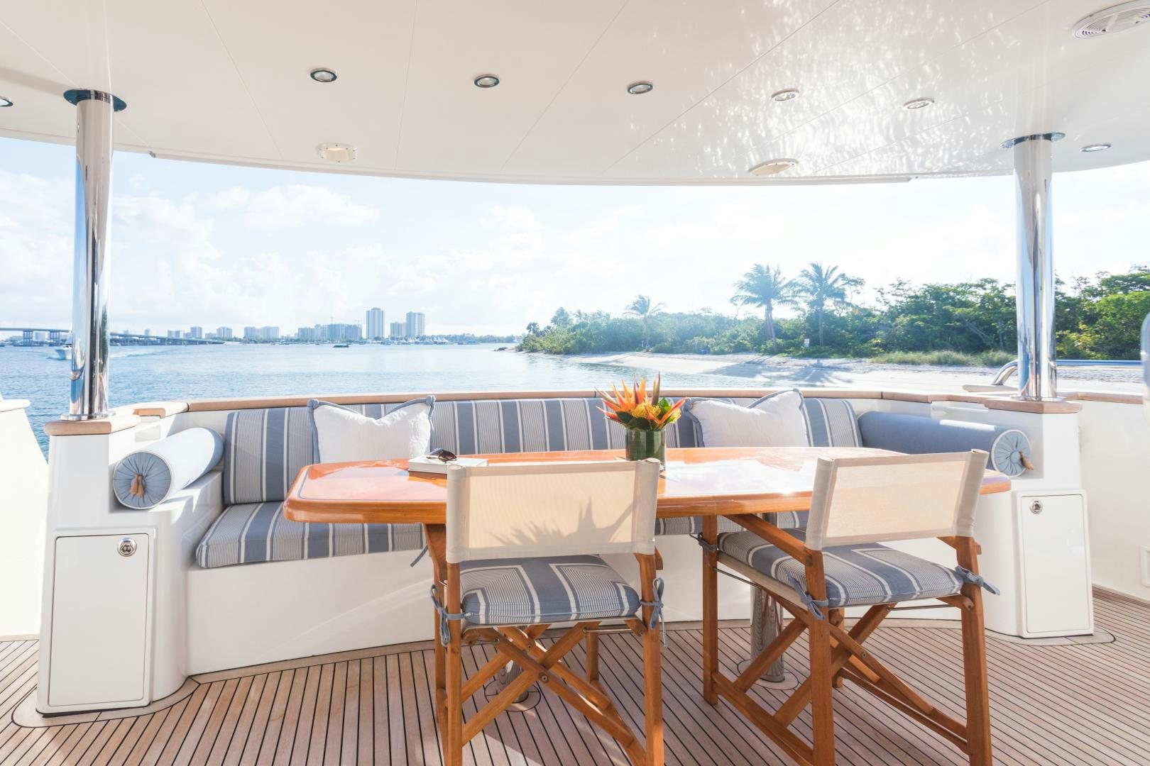 a table and chairs on a deck aboard SUNNY Yacht for Sale