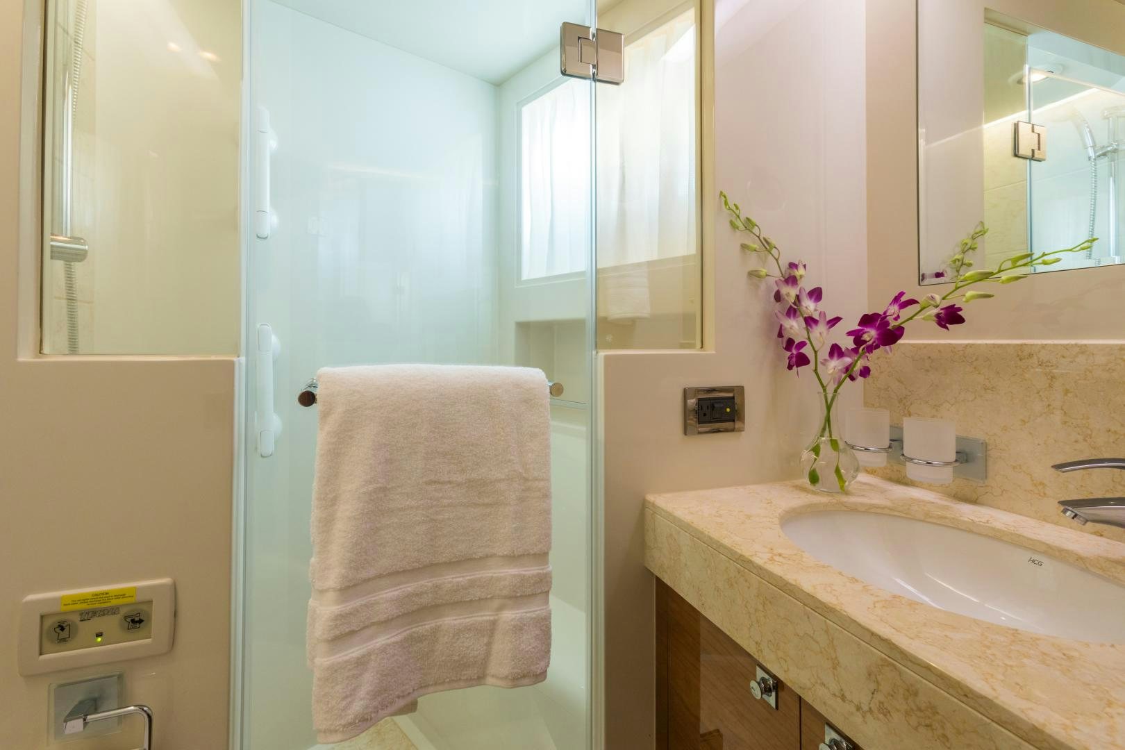 a bathroom with a sink and a mirror aboard SUNNY Yacht for Sale
