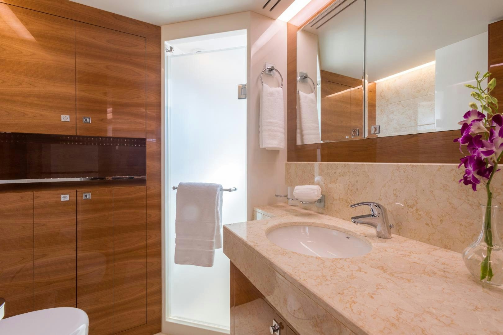 a bathroom with a sink and a shower aboard SUNNY Yacht for Sale