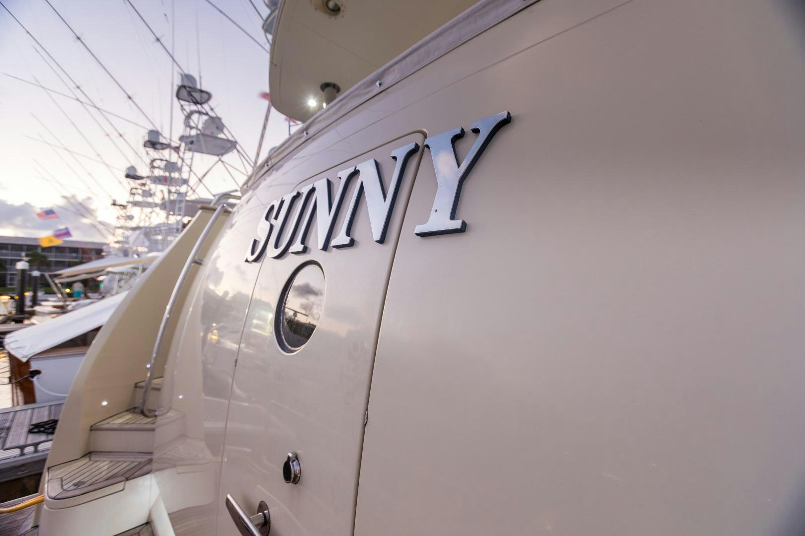 a white boat with a sign on it aboard SUNNY Yacht for Sale