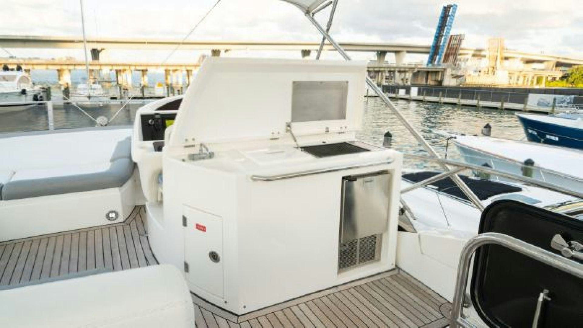 a white boat on a dock aboard MANCUSA Yacht for Sale
