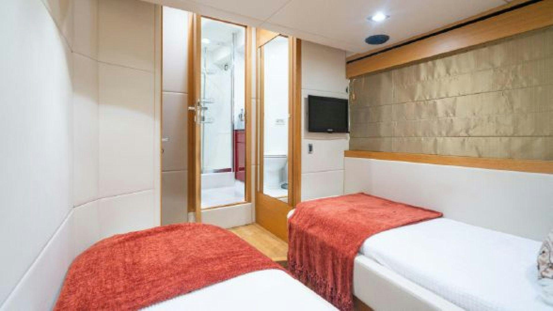 a room with two beds aboard MANCUSA Yacht for Sale