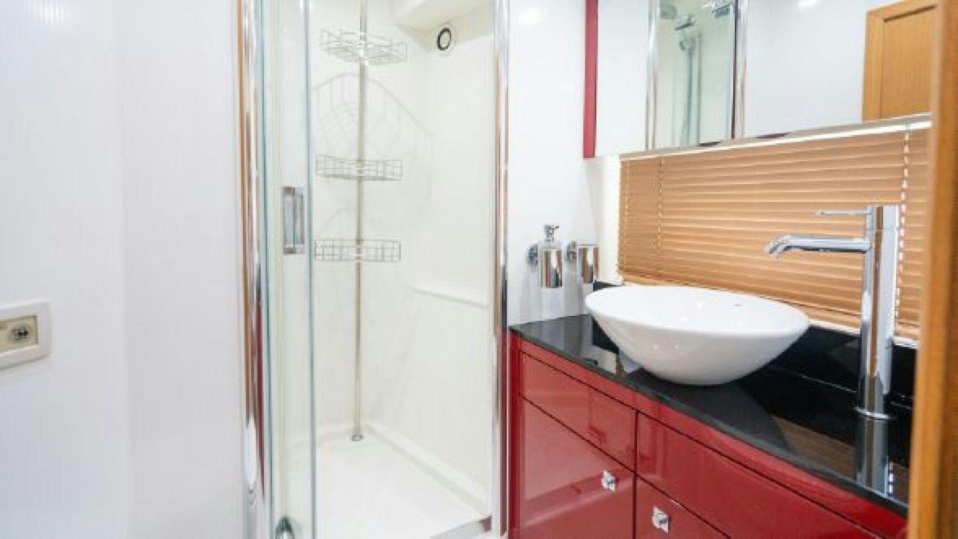 a bathroom with a sink and a shower aboard MANCUSA Yacht for Sale