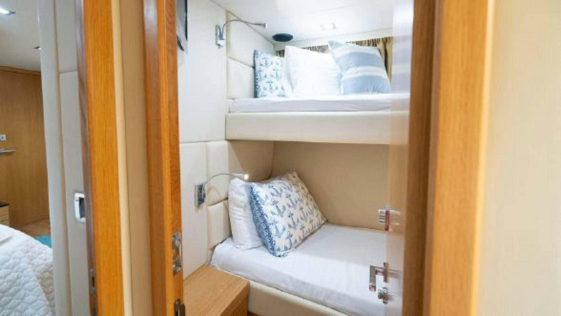 a room with a bed and a closet aboard MANCUSA Yacht for Sale