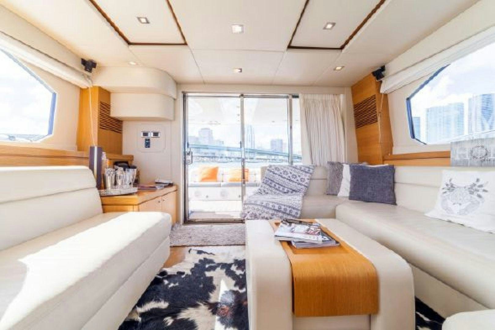 a living room with a large window aboard MANCUSA Yacht for Sale