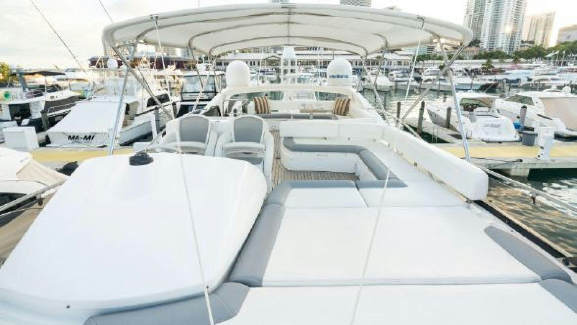 a boat on the water with Ice hockey rink in the background aboard MANCUSA Yacht for Sale