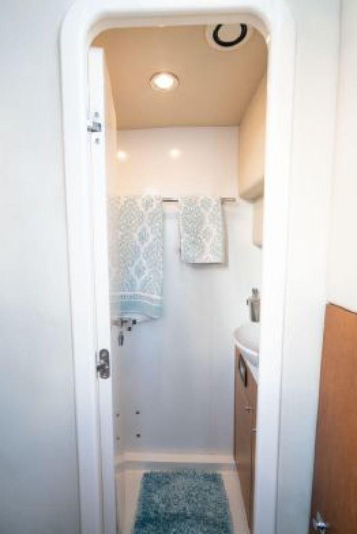 a bathroom with a sink and towels aboard MANCUSA Yacht for Sale