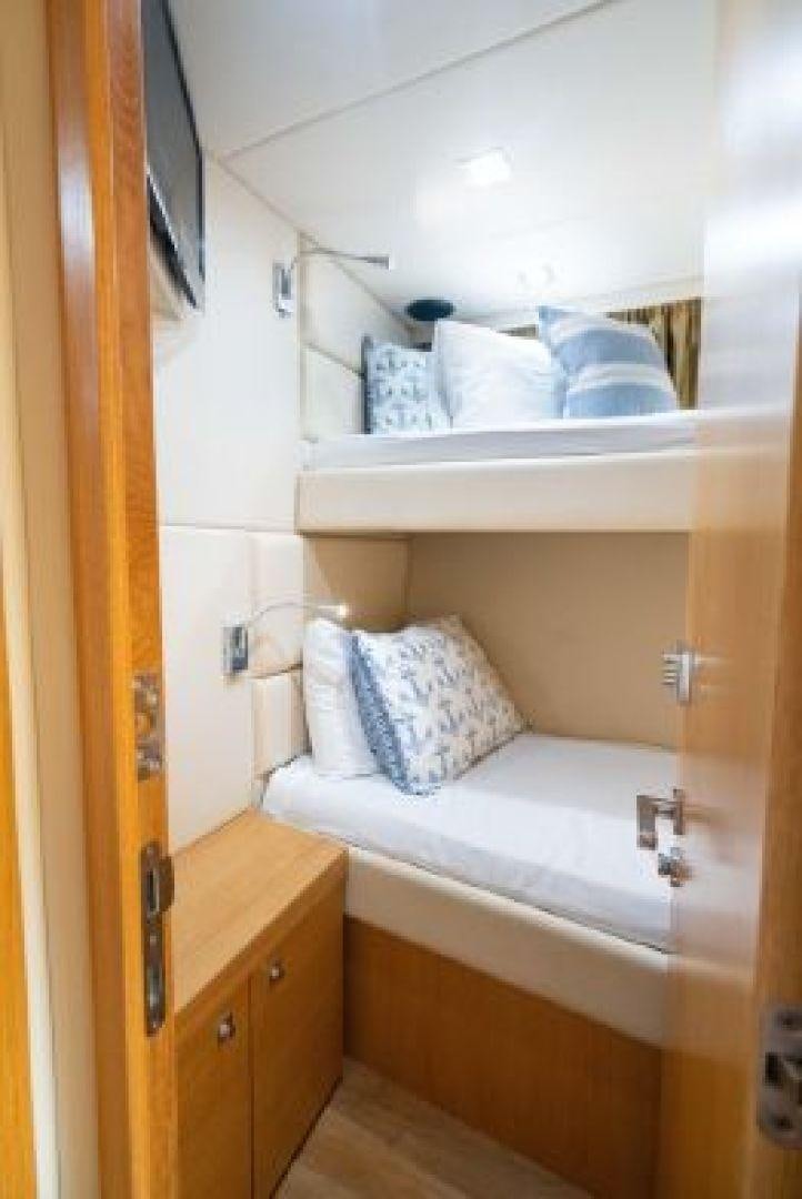 a room with a bed and a sink aboard MANCUSA Yacht for Sale