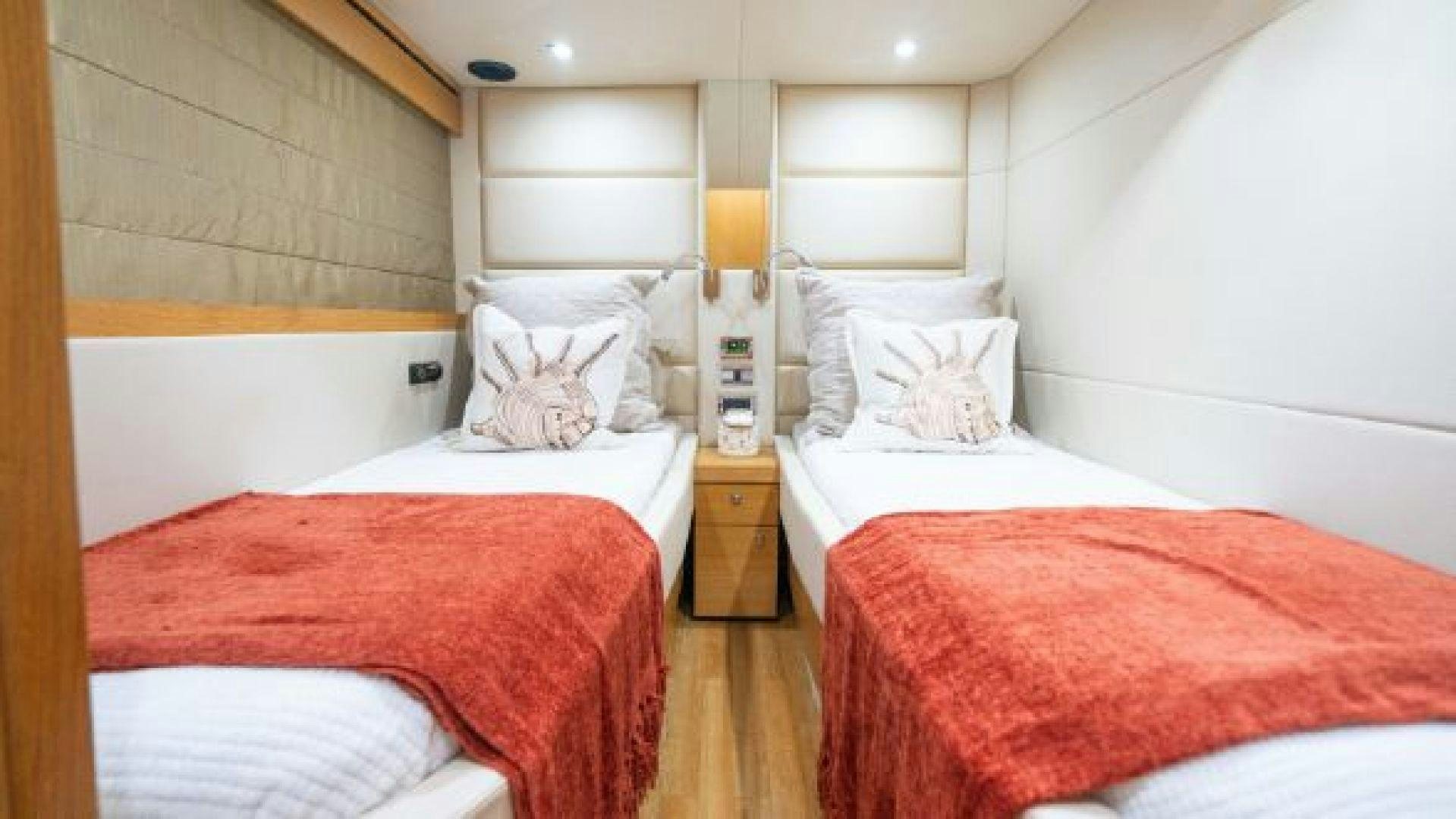 a couple of beds in a hotel room aboard MANCUSA Yacht for Sale