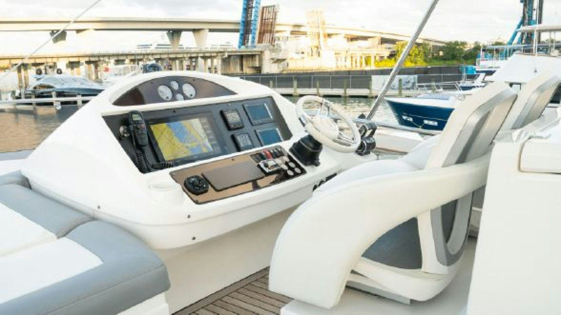 a white car with a black interior aboard MANCUSA Yacht for Sale