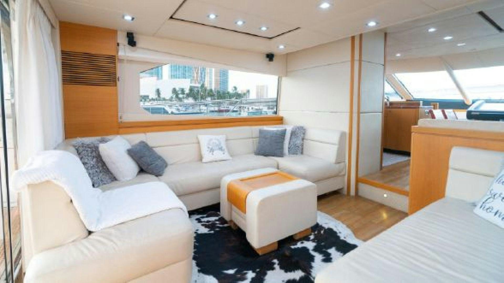 a room with a bed and a couch aboard MANCUSA Yacht for Sale