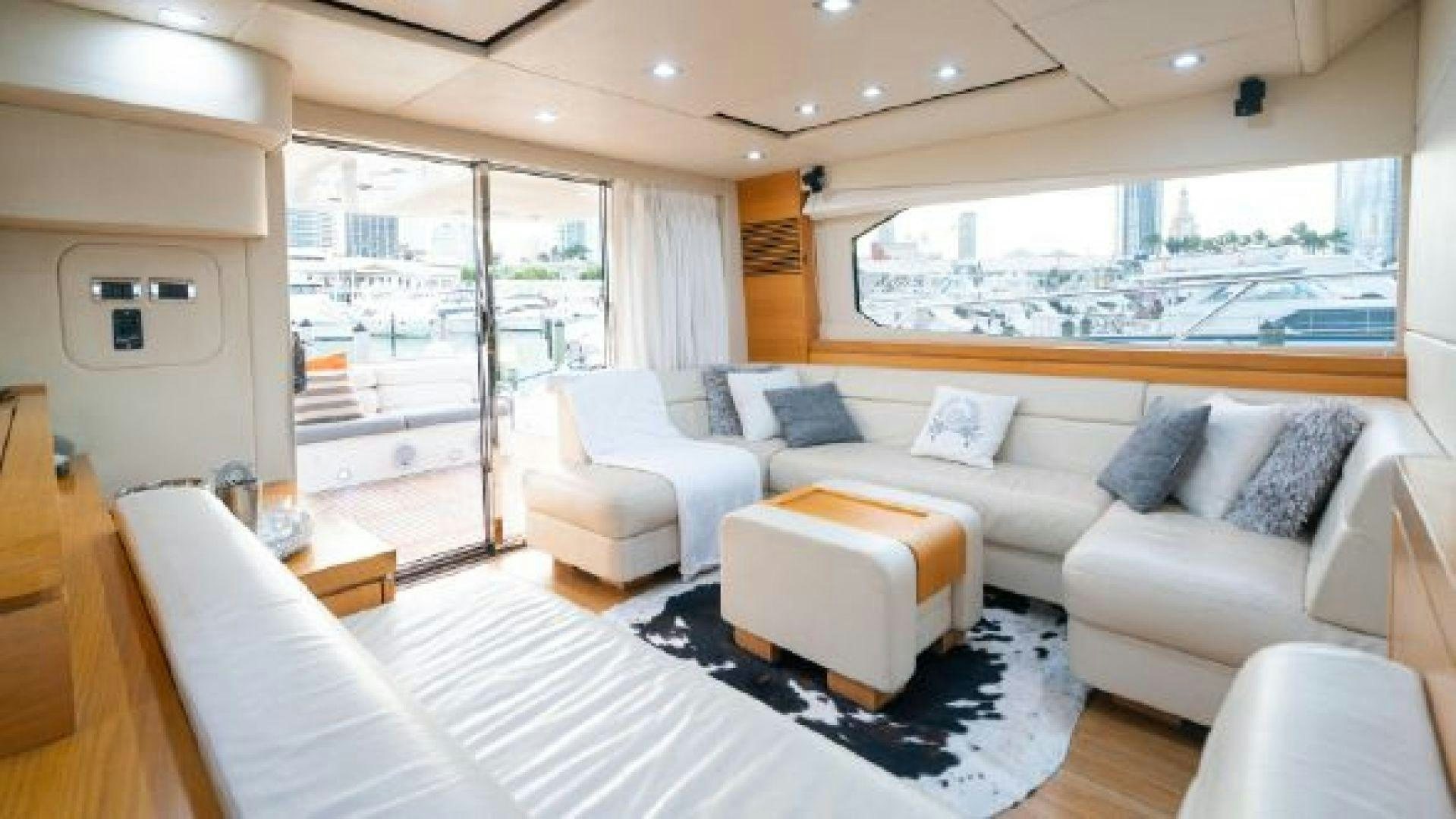 a living room with a large window aboard MANCUSA Yacht for Sale
