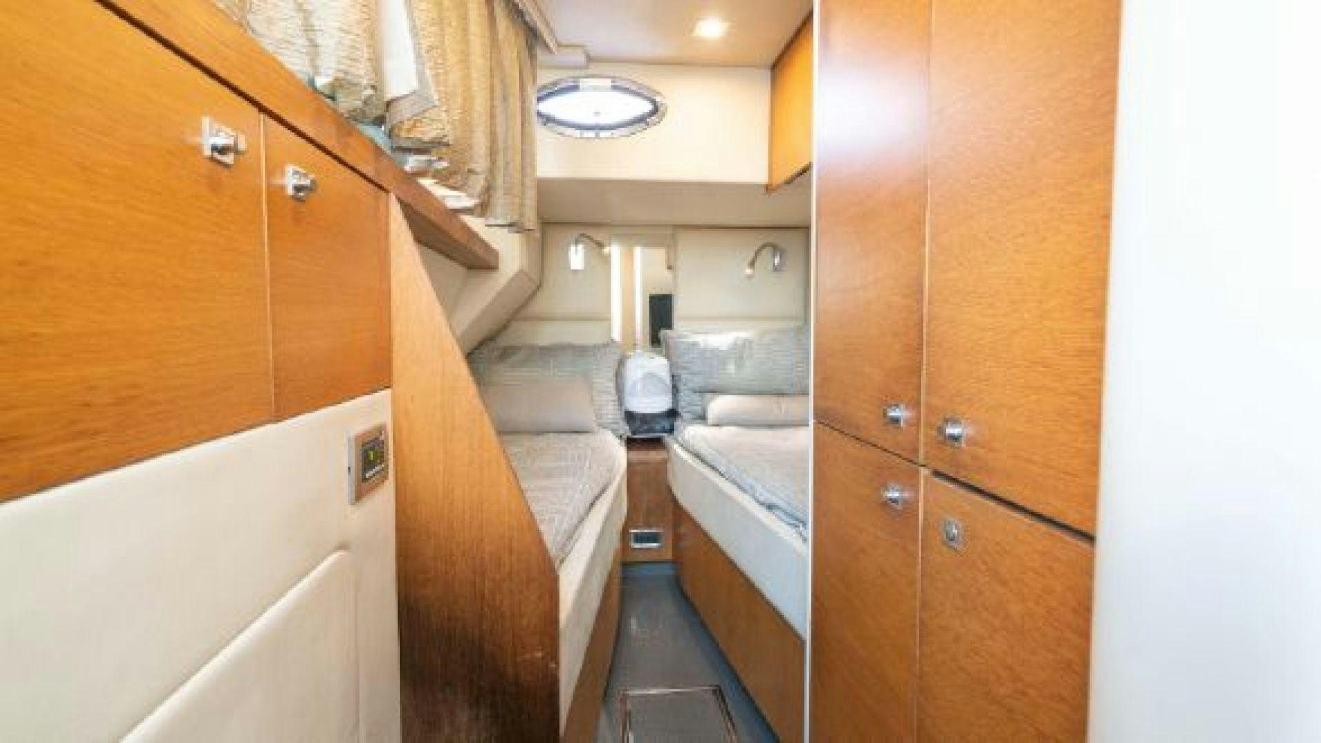 a bathroom with a bed and a sink aboard MANCUSA Yacht for Sale