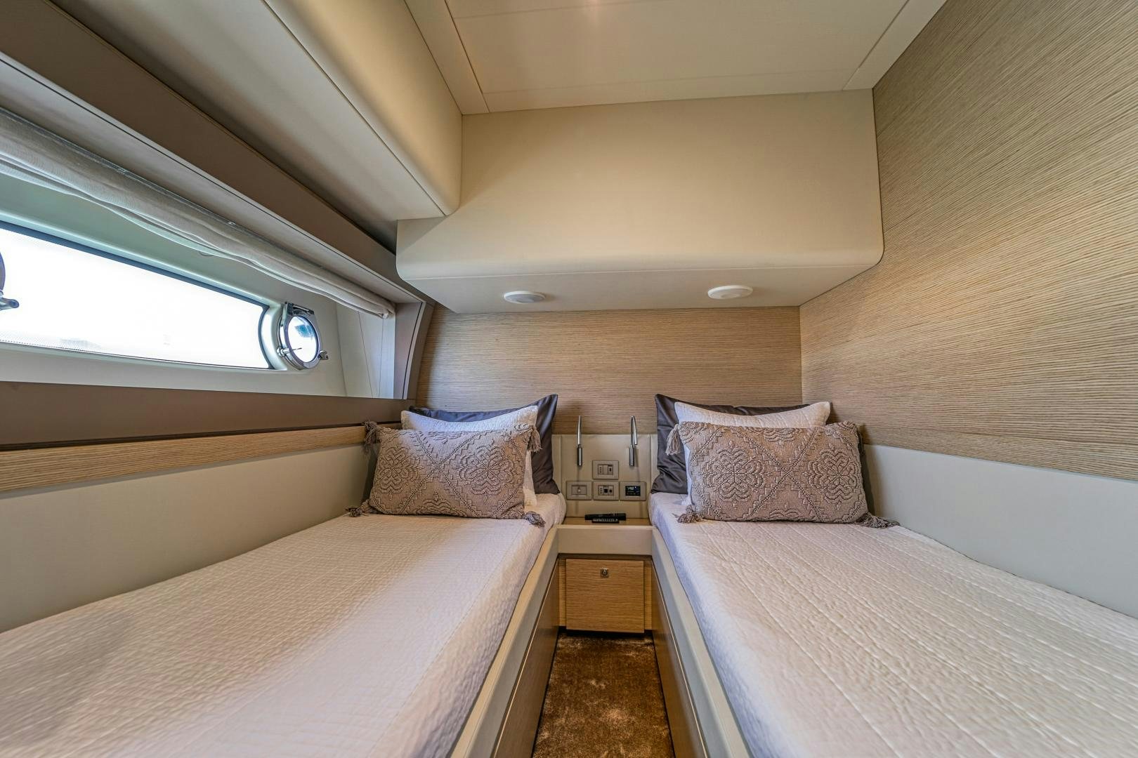 a room with two beds aboard KAOS II Yacht for Sale