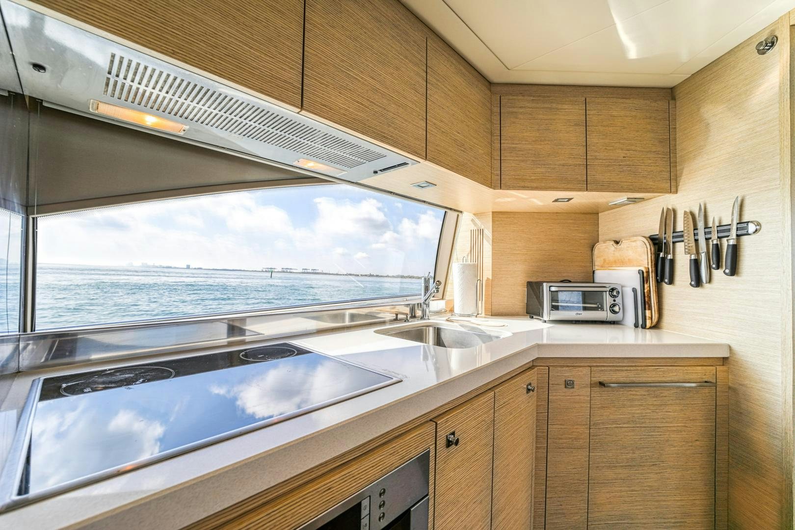 a kitchen with a large window aboard KAOS II Yacht for Sale