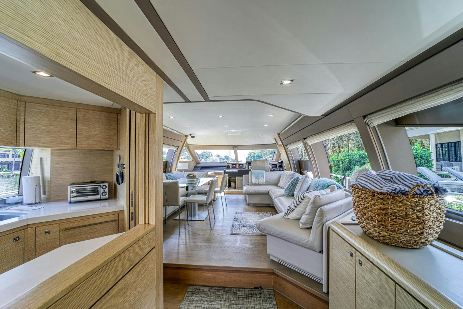 a kitchen with a microwave oven and a table aboard KAOS II Yacht for Sale