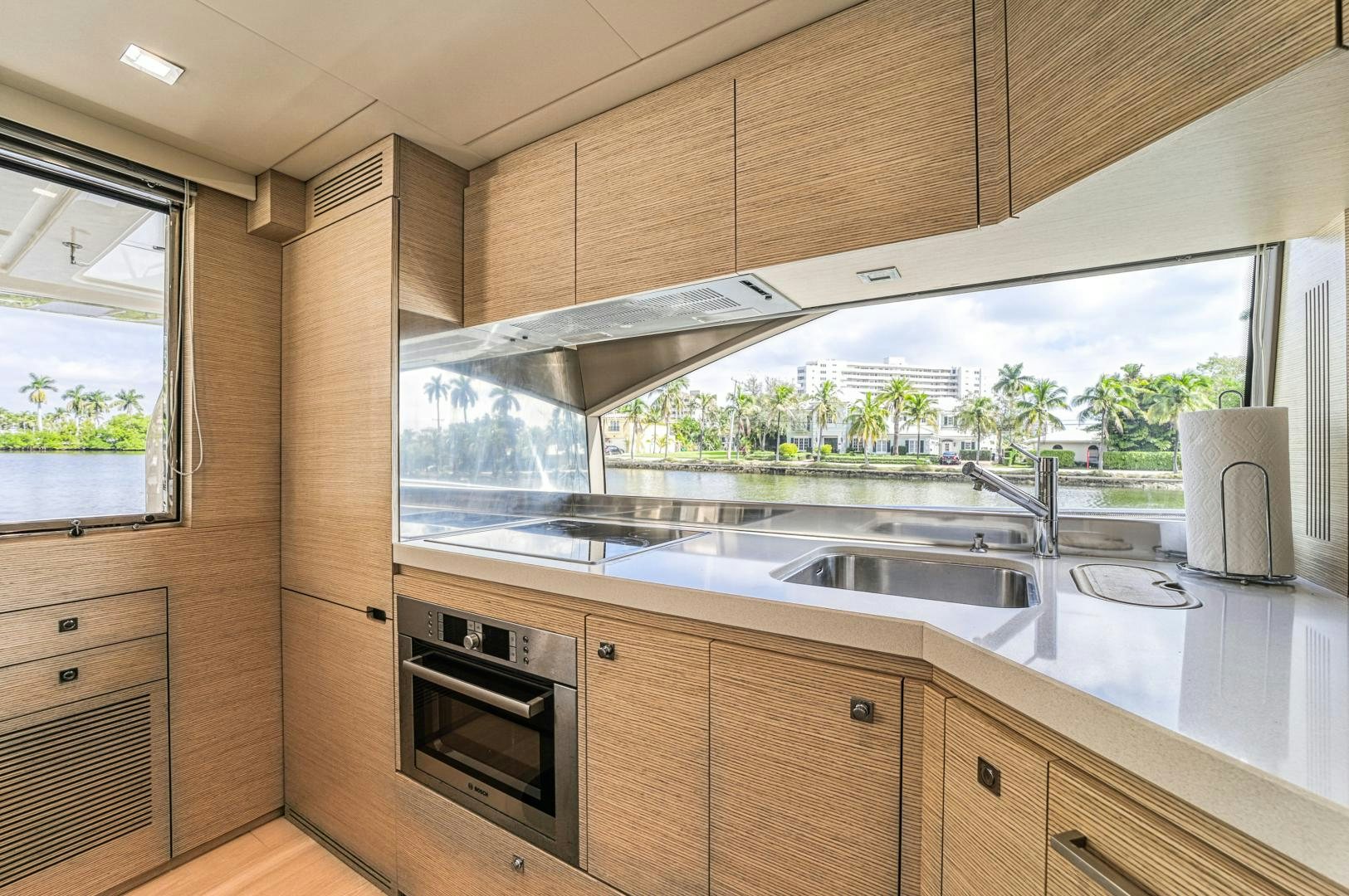 a kitchen with a glass window aboard KAOS II Yacht for Sale