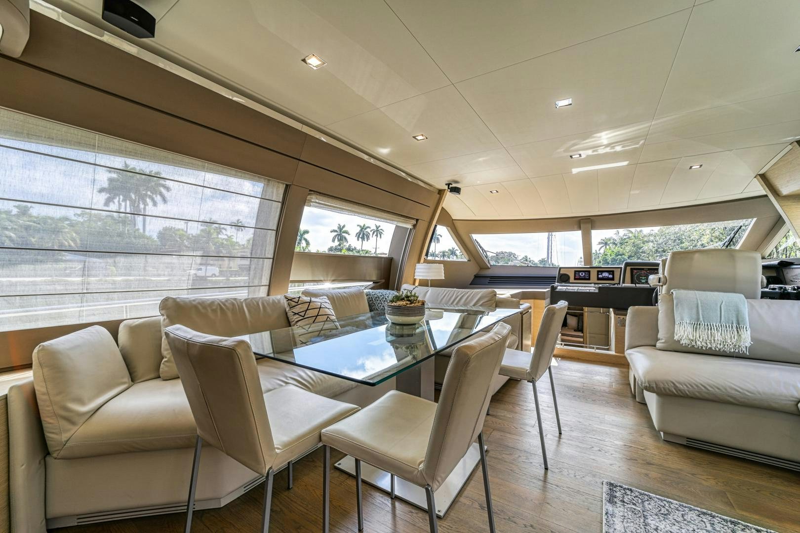 a room with a table chairs and a couch aboard KAOS II Yacht for Sale