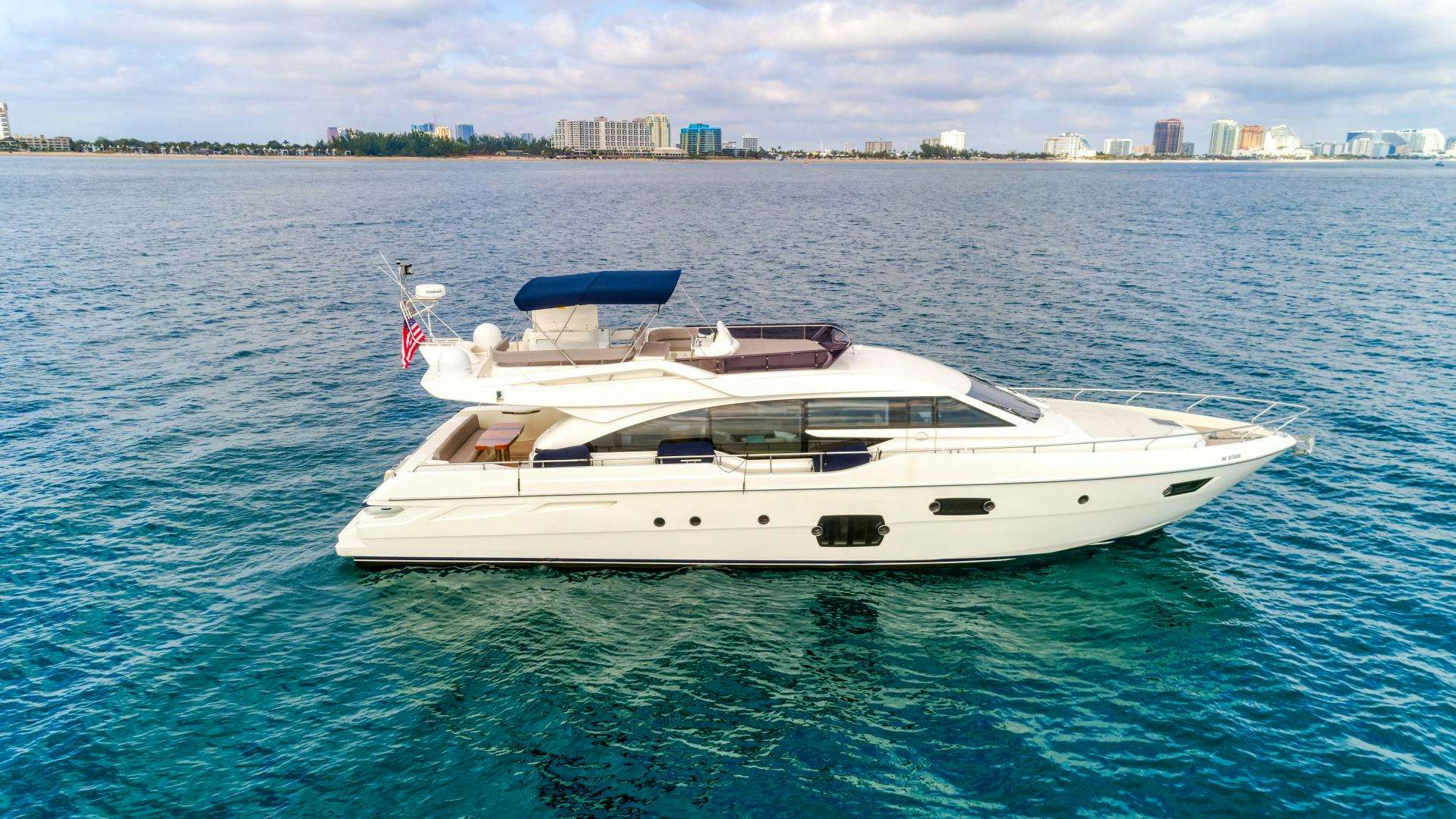 a white boat in the water aboard KAOS II Yacht for Sale