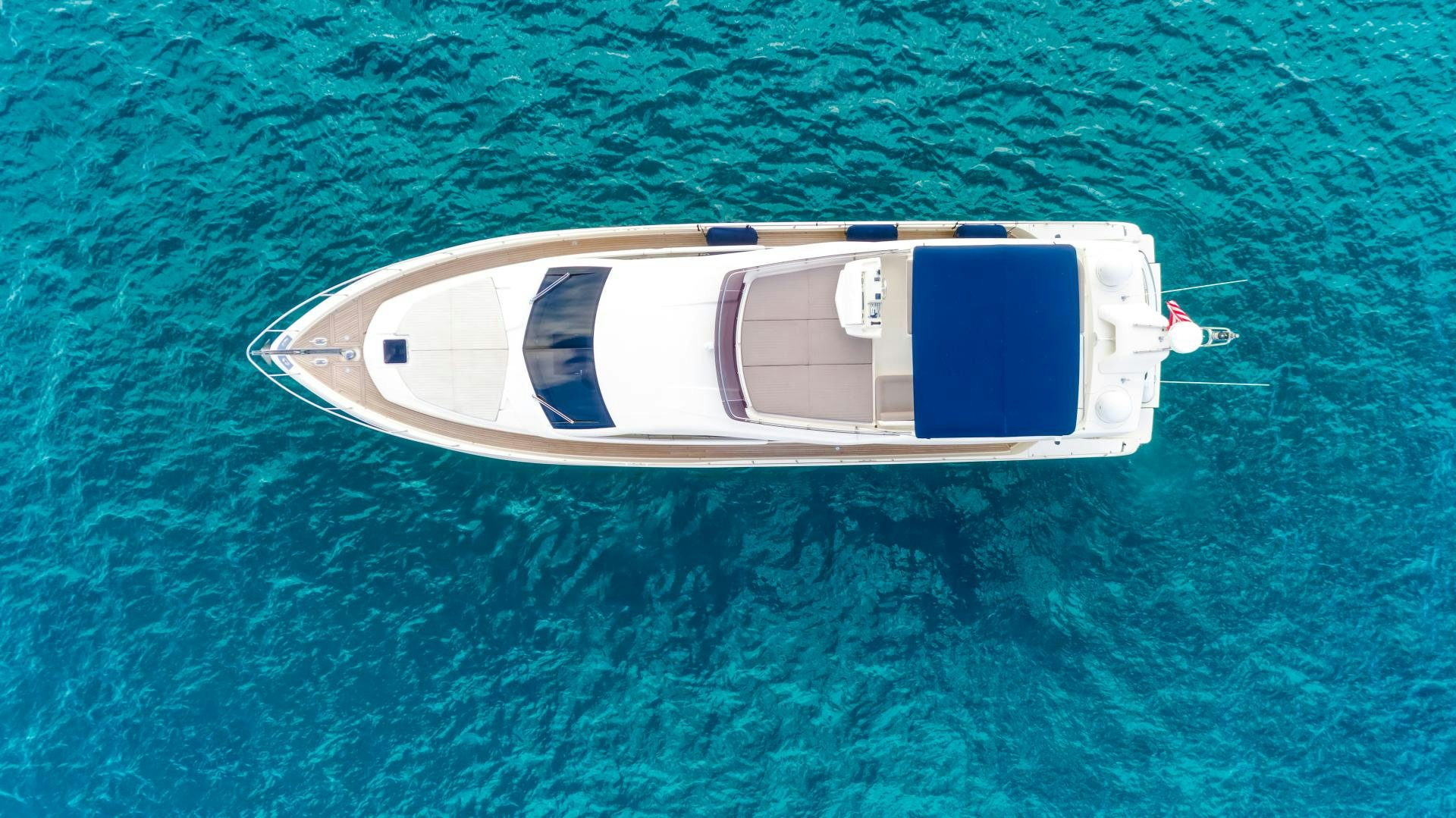 a white rectangular object on a green surface aboard KAOS II Yacht for Sale