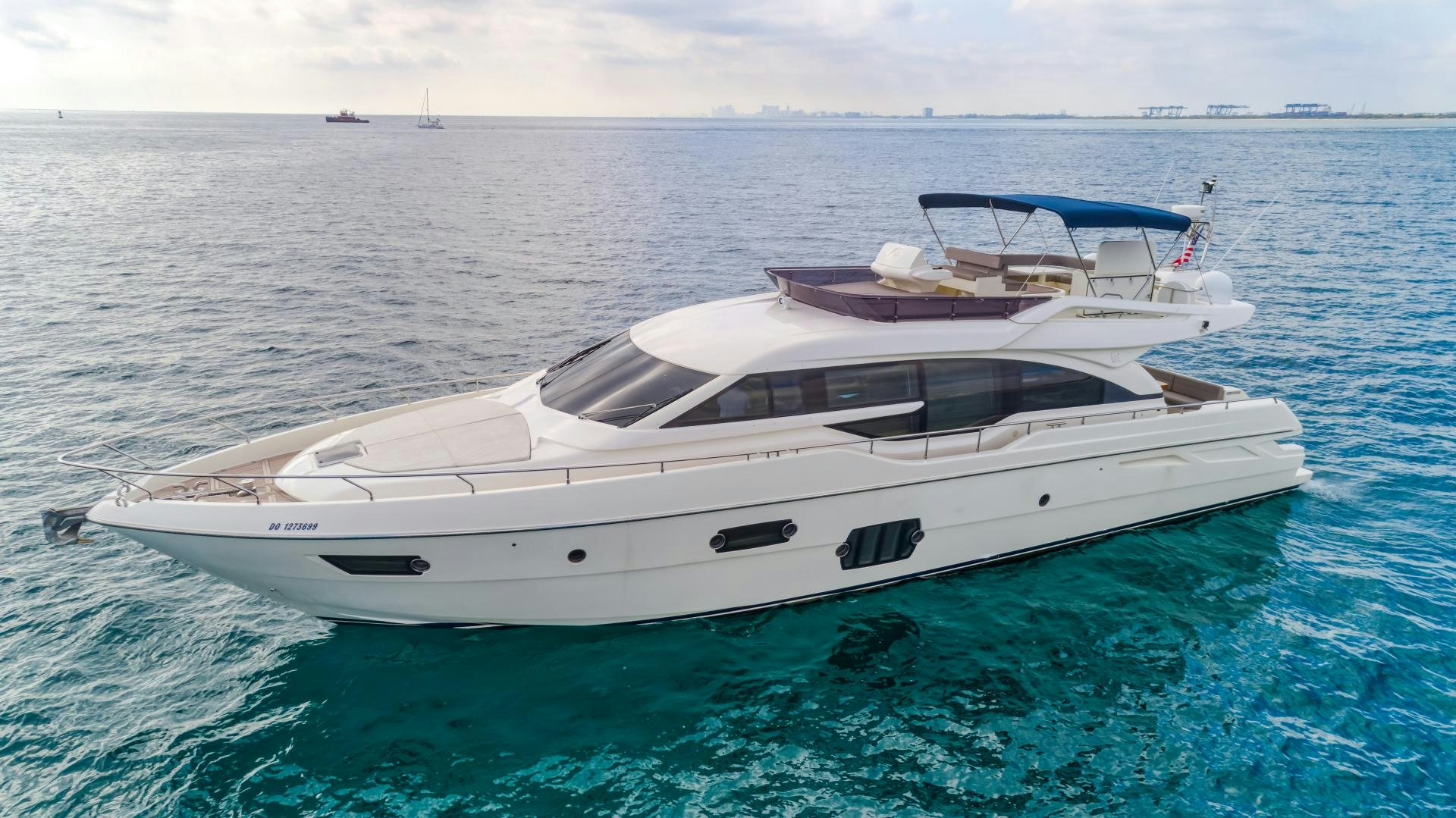 a white yacht in the water aboard KAOS II Yacht for Sale