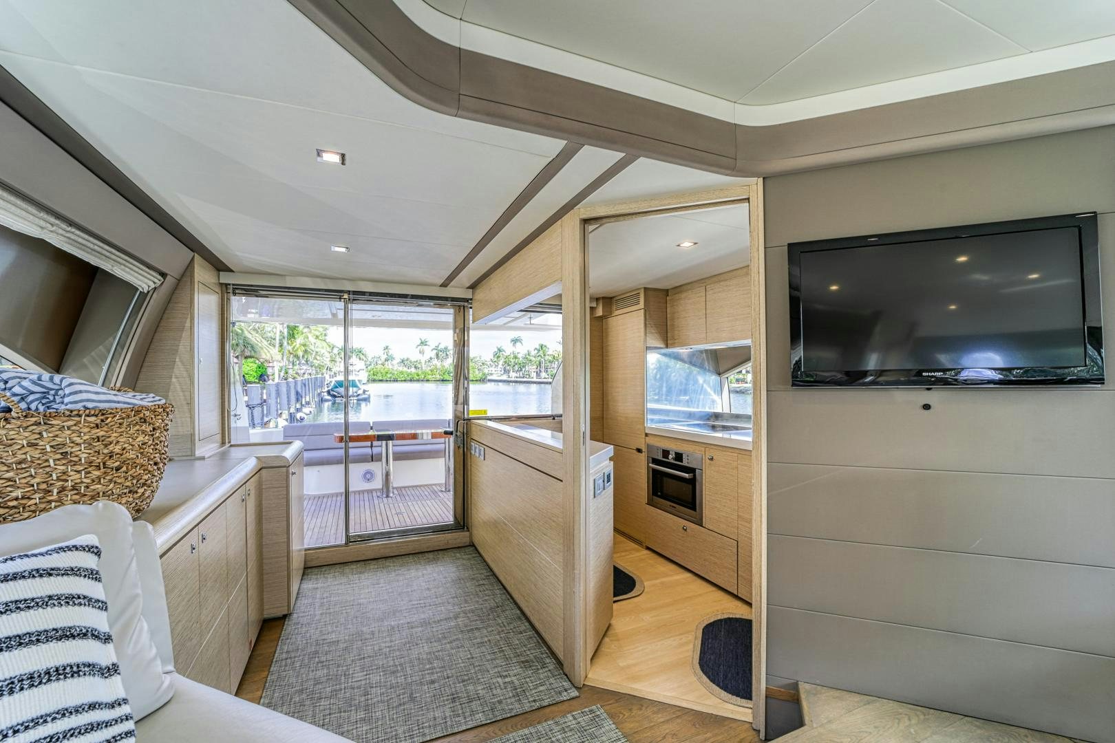 a living room with a sliding glass door aboard KAOS II Yacht for Sale