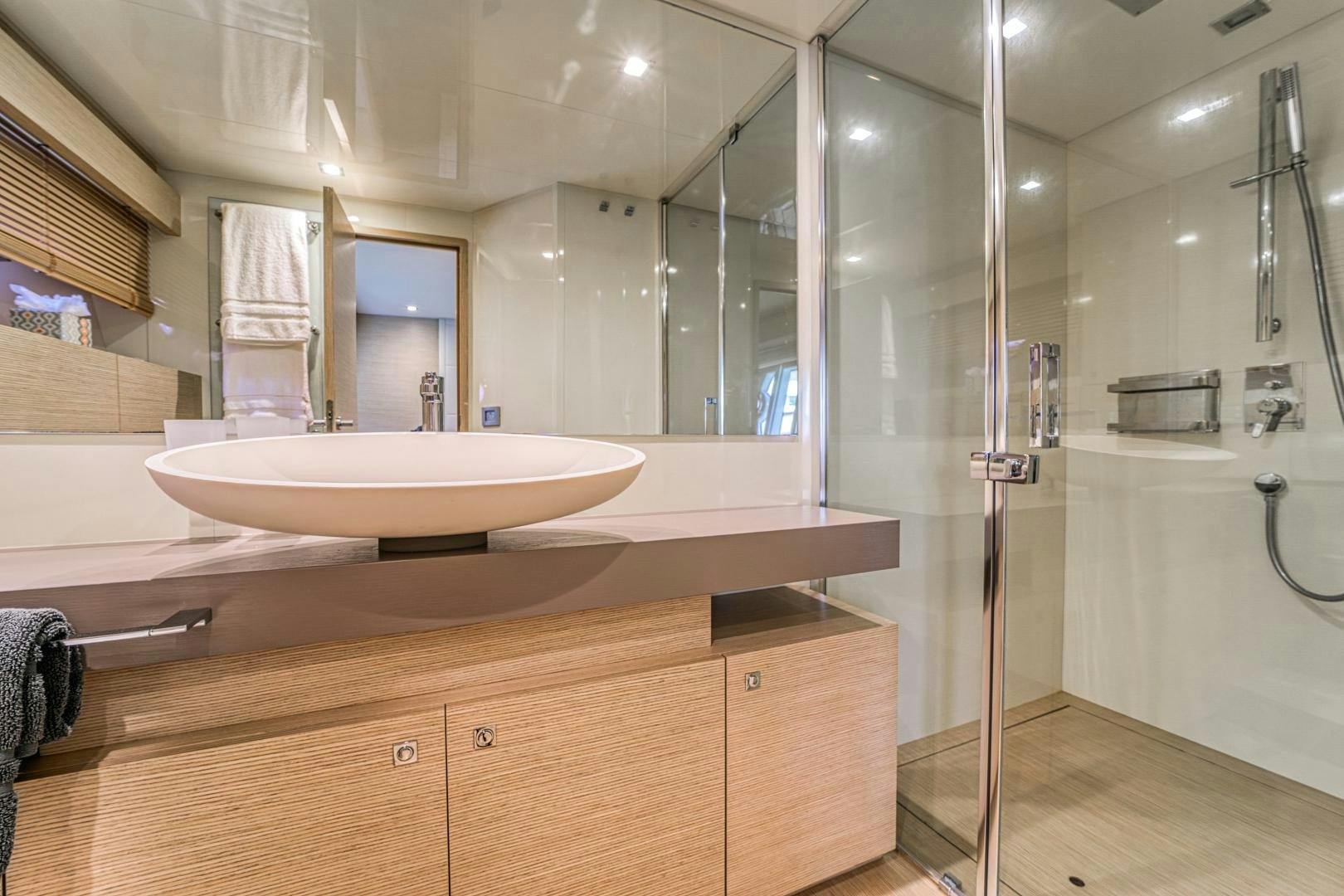 a bathroom with a sink and a shower aboard KAOS II Yacht for Sale