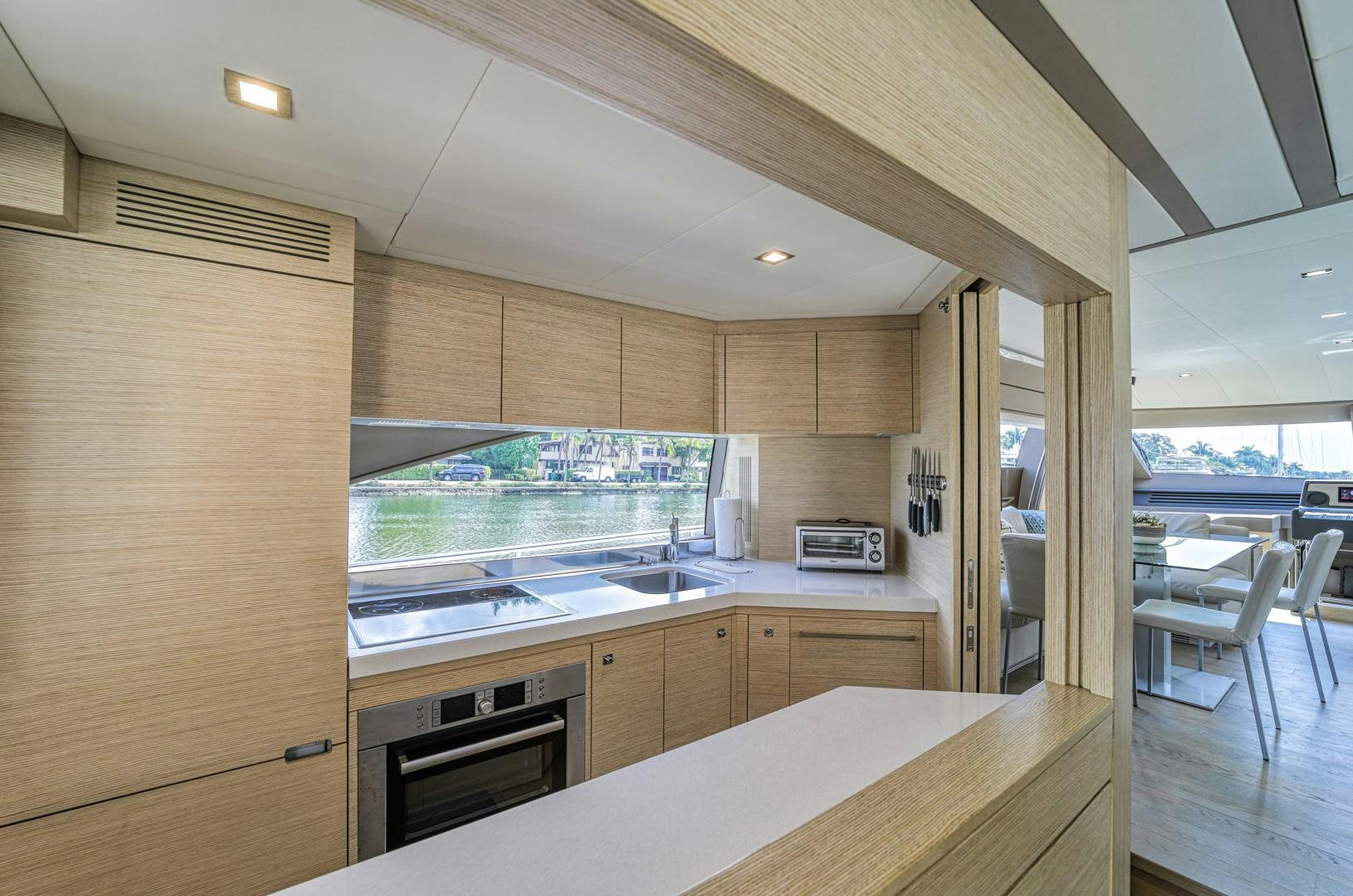 a kitchen with a large window aboard KAOS II Yacht for Sale