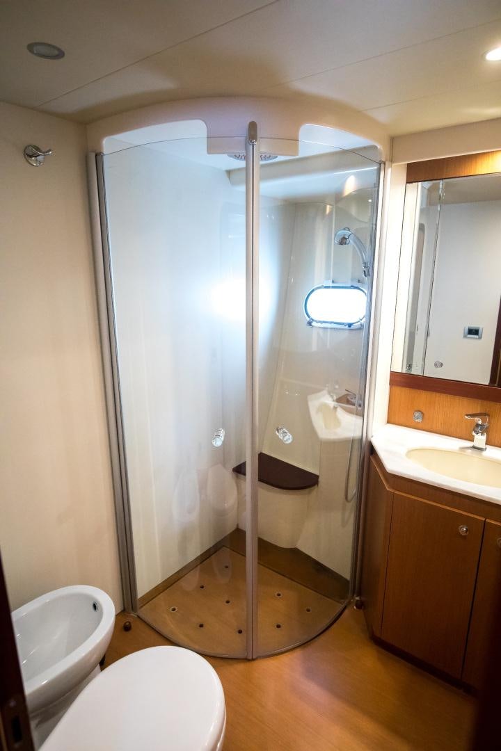 a bathroom with a shower unit and sink aboard TESA Yacht for Sale
