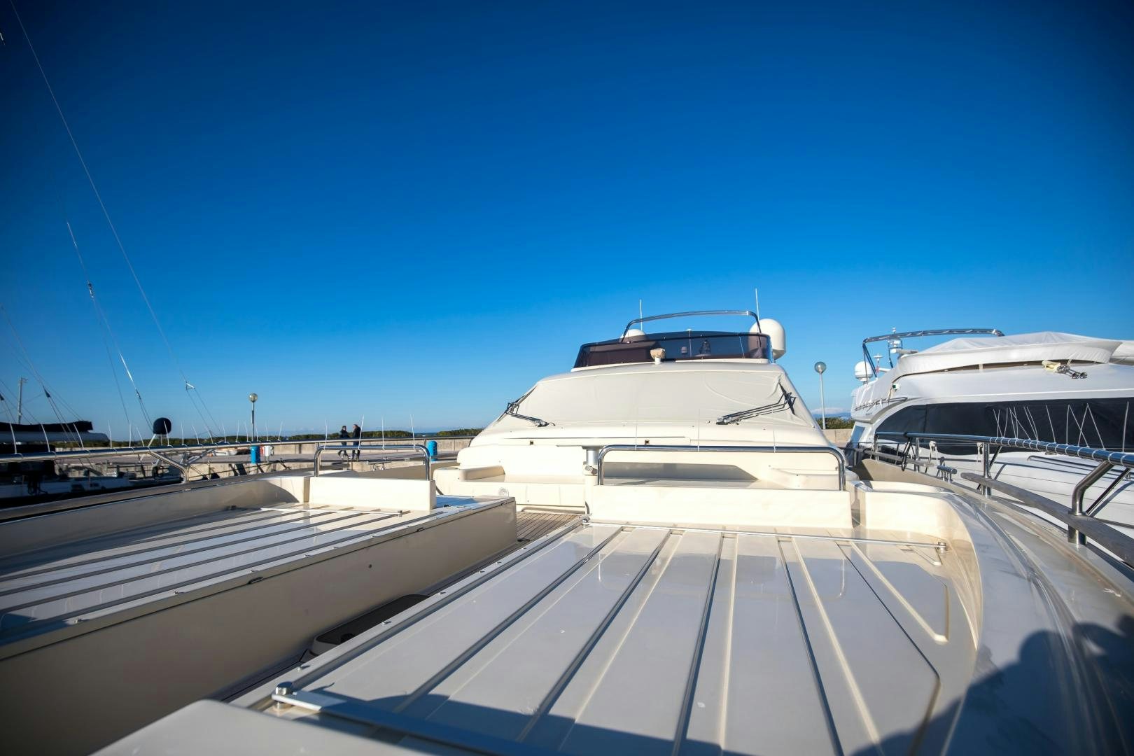a boat docked at a pier aboard TESA Yacht for Sale