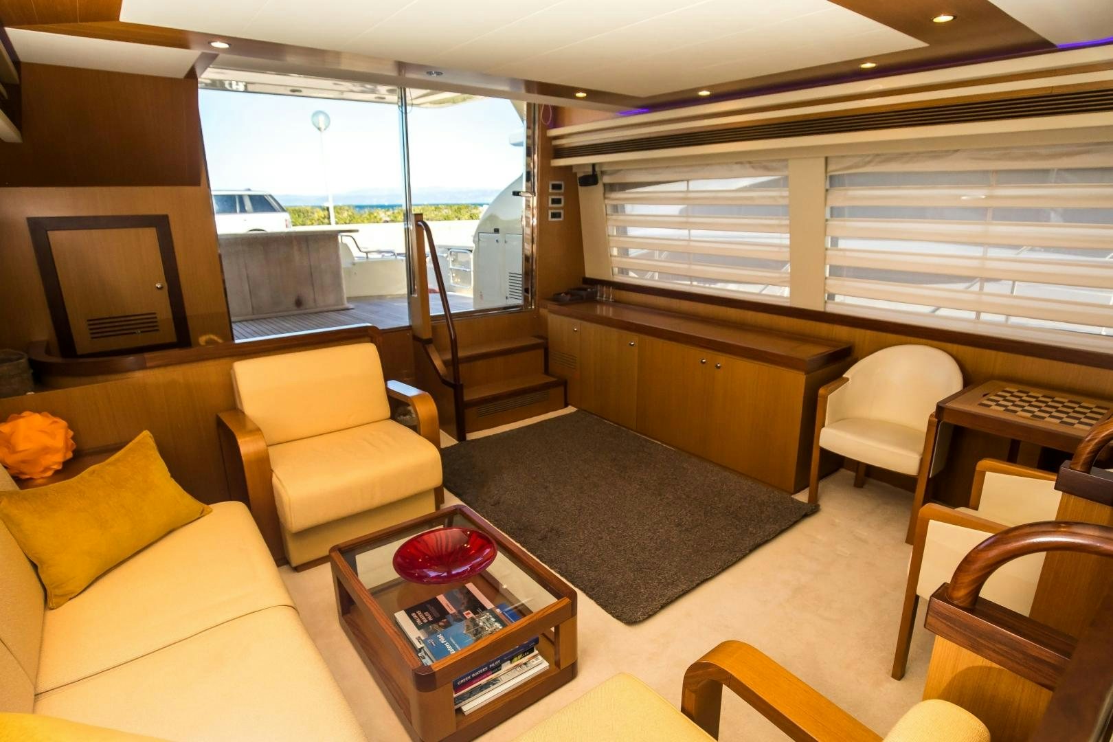 a living room with a large window aboard TESA Yacht for Sale