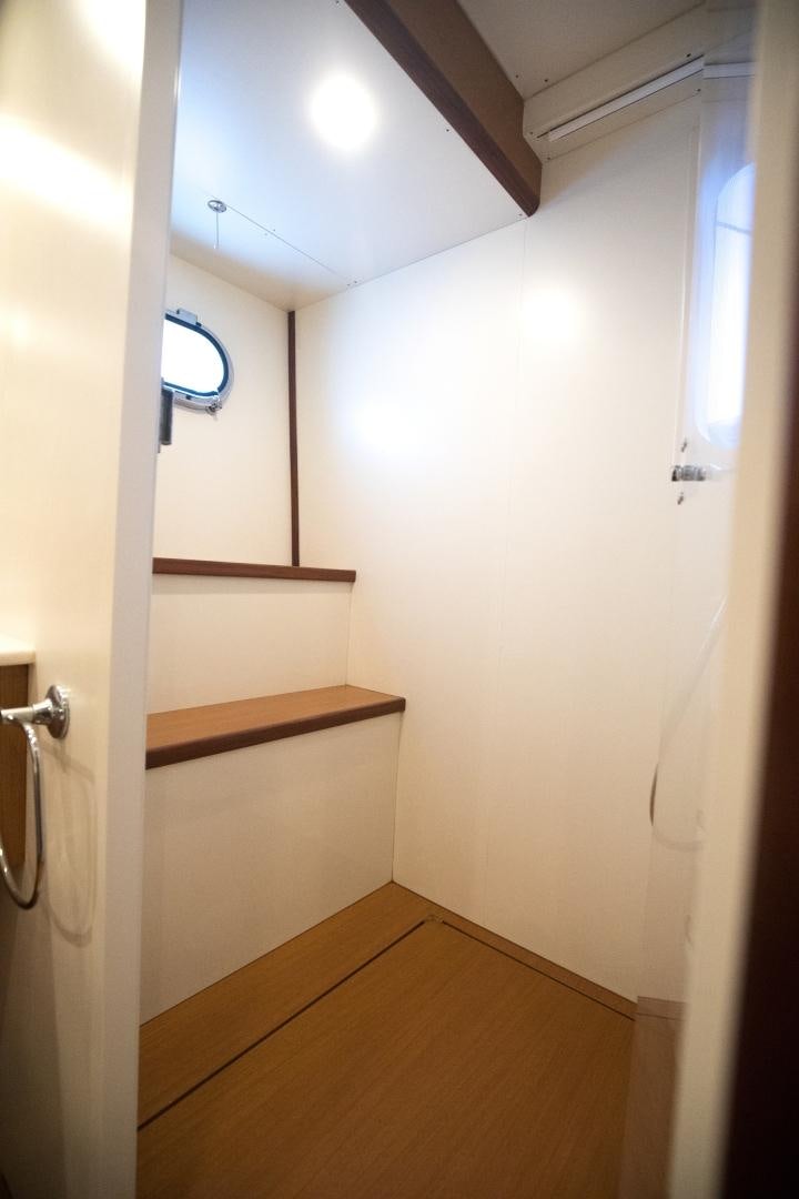 a bathroom with a wood counter aboard TESA Yacht for Sale