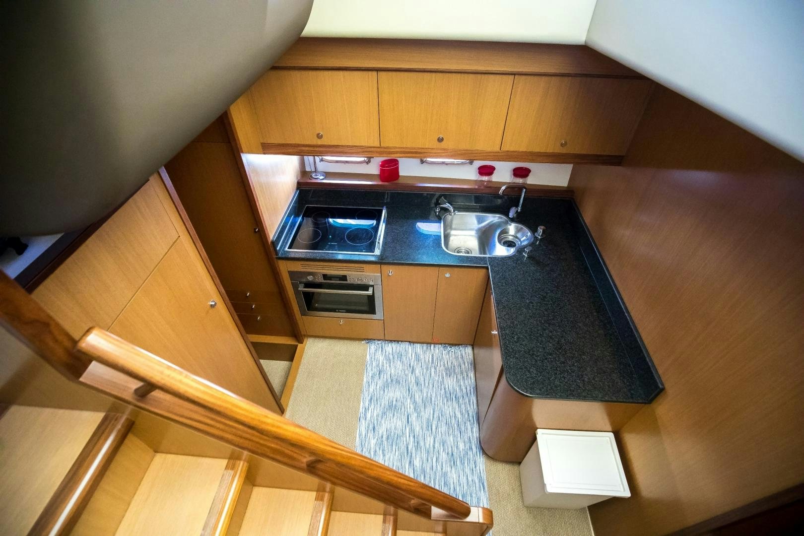 a kitchen with a sink and a stove aboard TESA Yacht for Sale