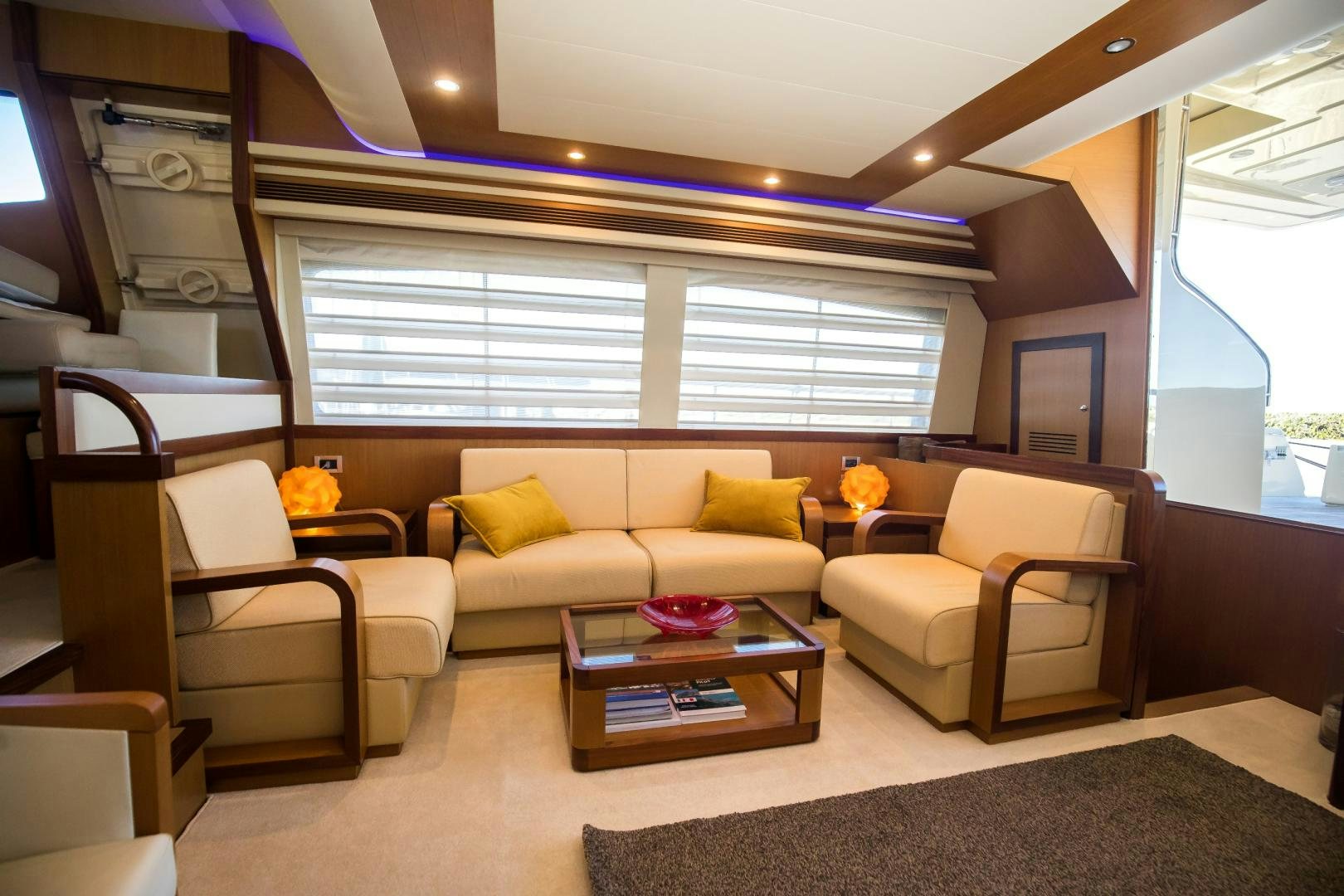 a living room with a couch and a coffee table aboard TESA Yacht for Sale