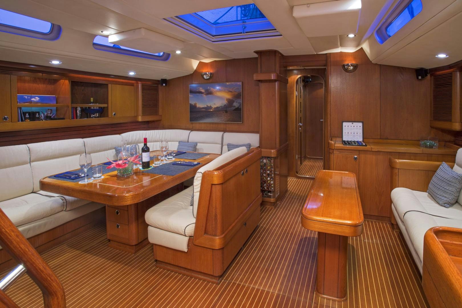 a room with a table and chairs aboard simple harmony Yacht for Sale