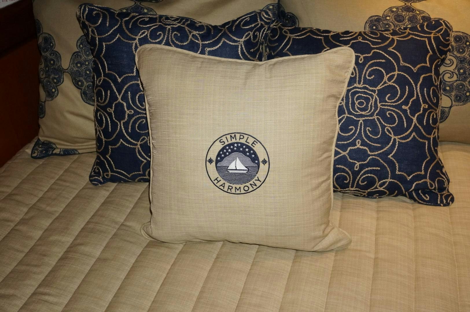 a pillow on a bed aboard simple harmony Yacht for Sale