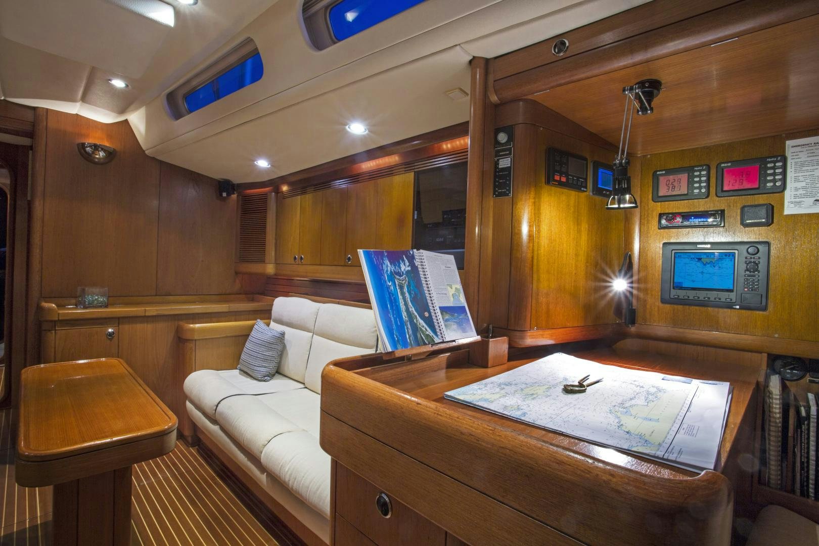 a room with a couch and a table aboard simple harmony Yacht for Sale