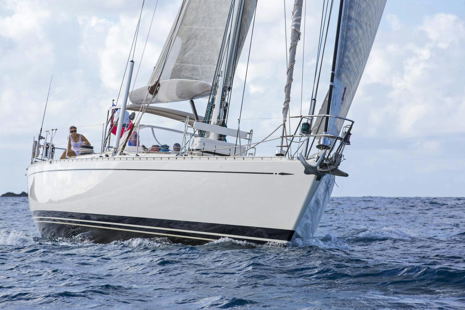 a white boat in the water aboard simple harmony Yacht for Sale