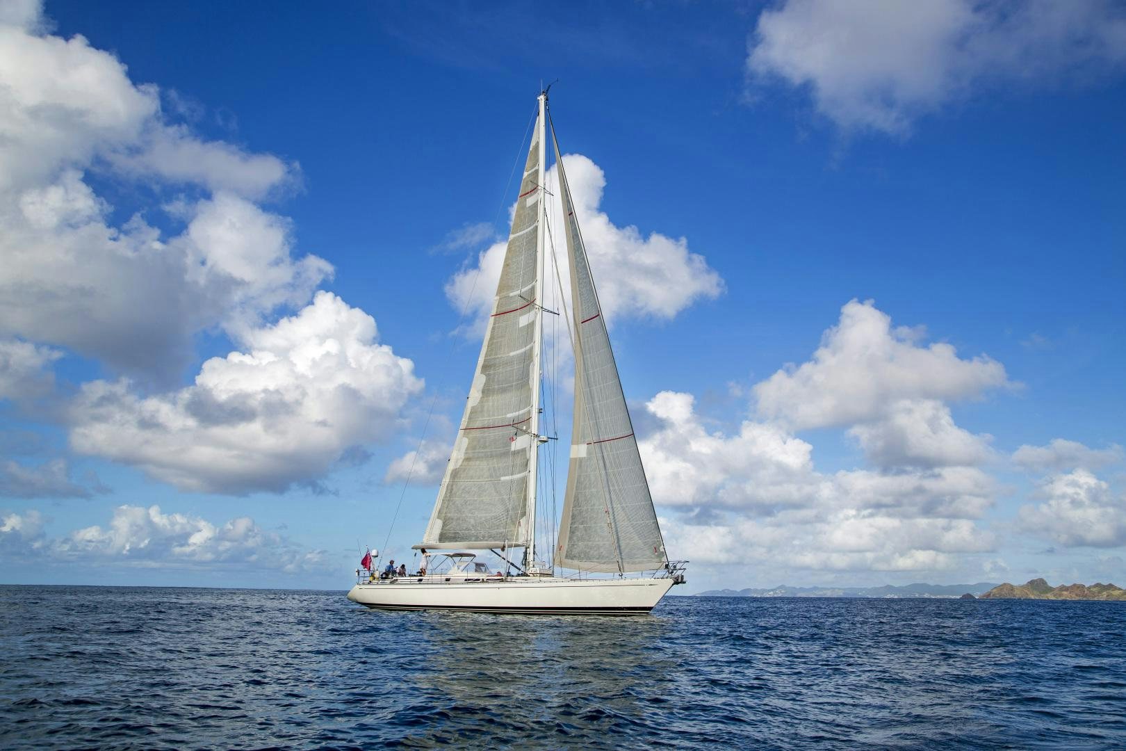 a sailboat on the water aboard simple harmony Yacht for Sale
