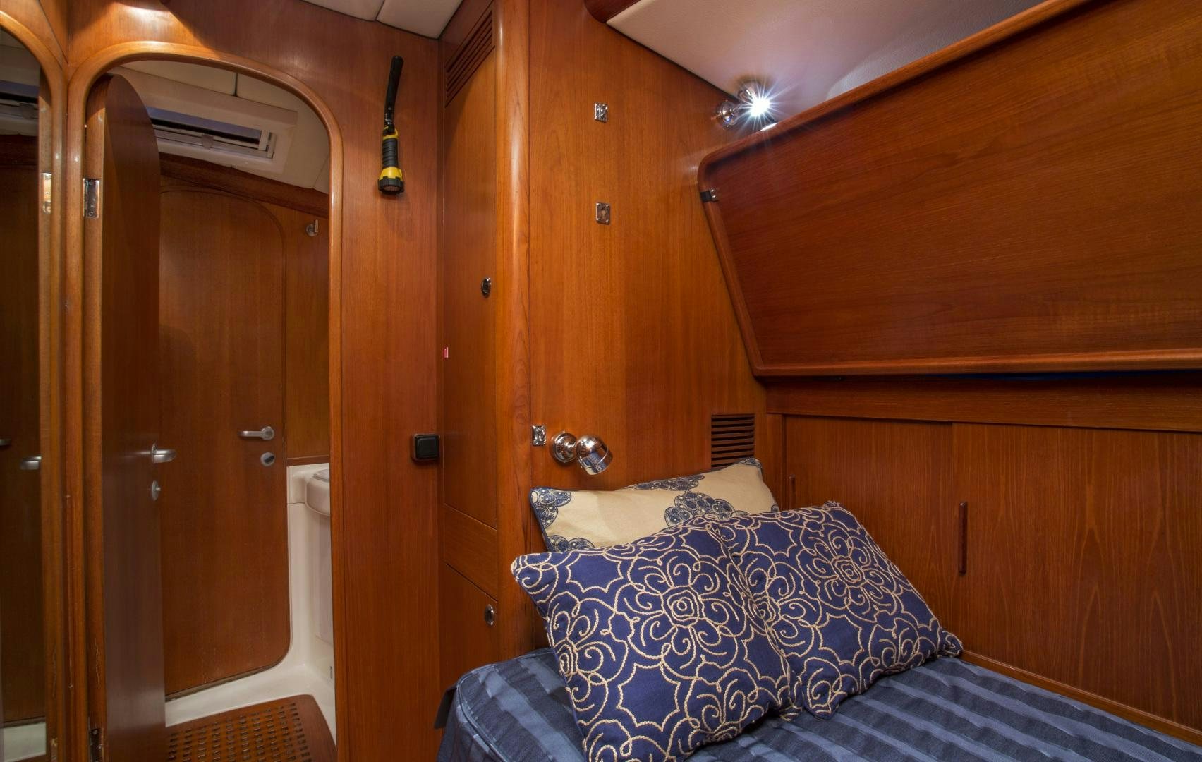 a bed in a room aboard simple harmony Yacht for Sale